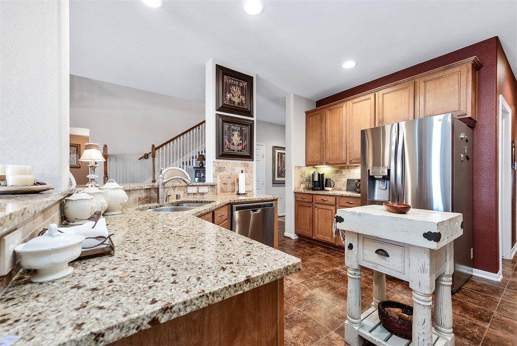 Additional cabinetry can be found in the coffee bar area - note the under cabinet lighting!