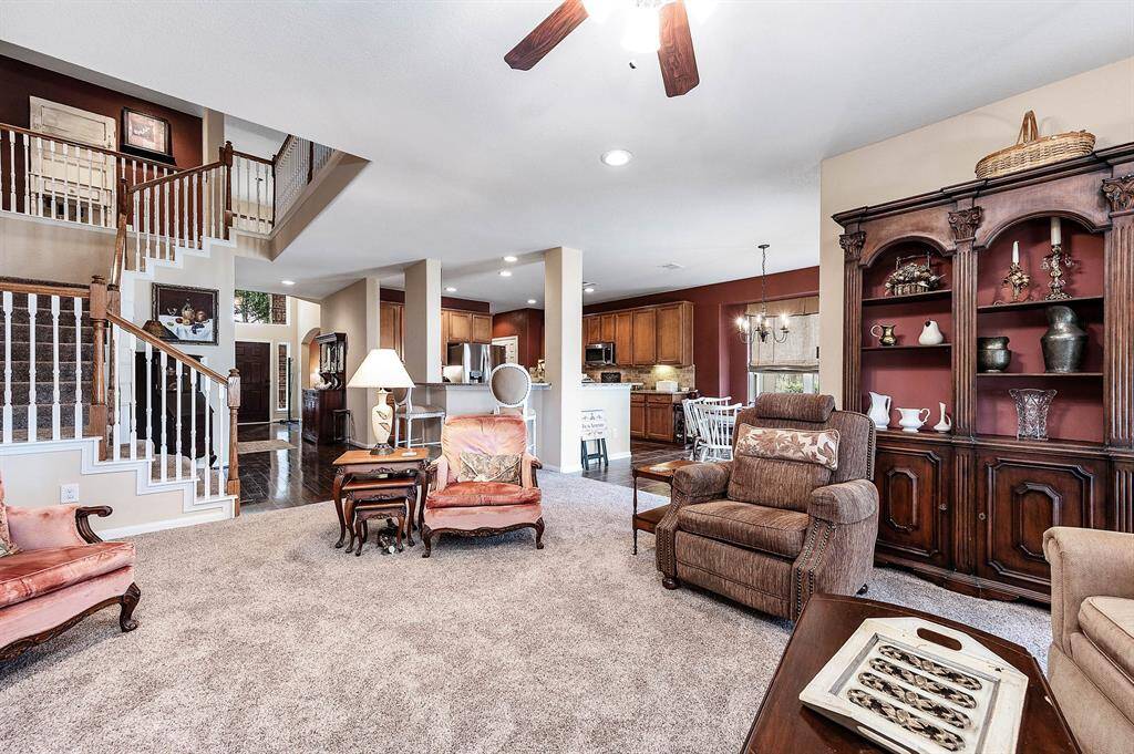 Heading back out to Family Room with a view towards the front of the house -- while we head upstairs. The two-landing staircase is a great feature for young children!