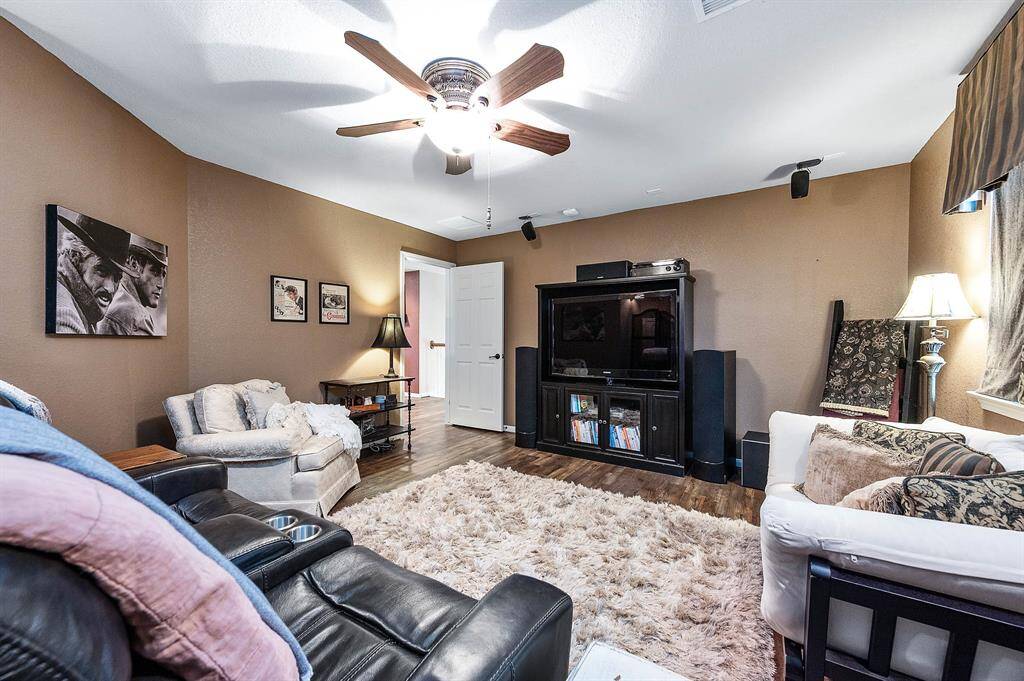 Soothing wall colors, ceiling fan with light fixture, and the LVP flooring encourages relaxation and enjoyment.