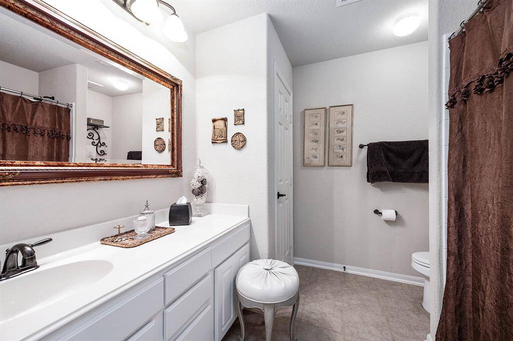Your guests (or family members!) will enjoy having their attached bath and space:  note the cabinet and linen closet storage!