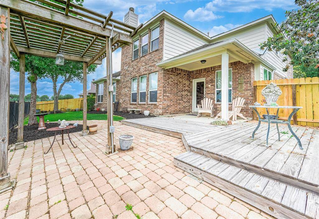 Both the covered patio and pergola are sure to provide shade for continued enjoyment through the summer months.