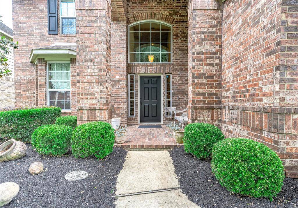 Welcoming 2-story front entrance