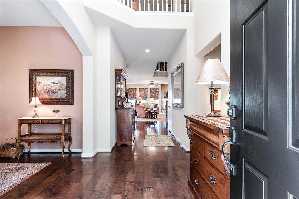 Gleaming wood floors welcome visitors to the home