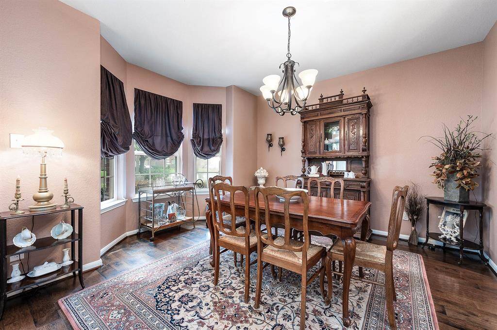Dining room overlooking the front yard through bay windows