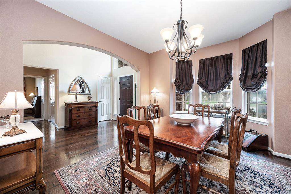 Arched entrances, neutral paint and decorator fixtures all frame the openness of the floor plan.