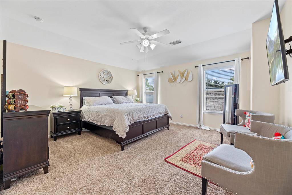How perfect is this primary suite? Spacious and filled with natural light, this serene retreat offers the ultimate escape, promising comfort, tranquility, and pure relaxation.