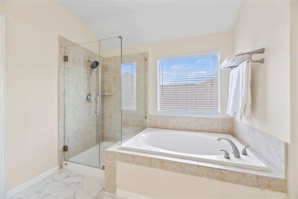 Relax in your deep soaking tub or opt for a quick rinse in the separate shower.