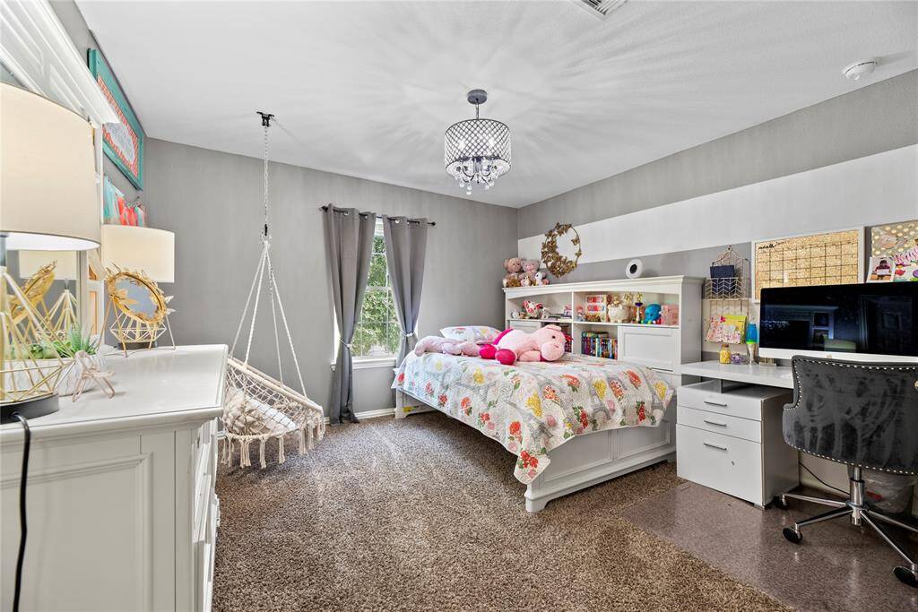 A large and versatile second bedroom provides ample space for relaxation or creative use.