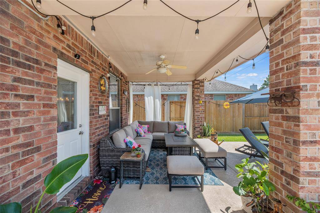 Enjoy outdoor living year-round on the covered back patio, with a clear view of the pool for relaxation or keeping an eye on the fun.