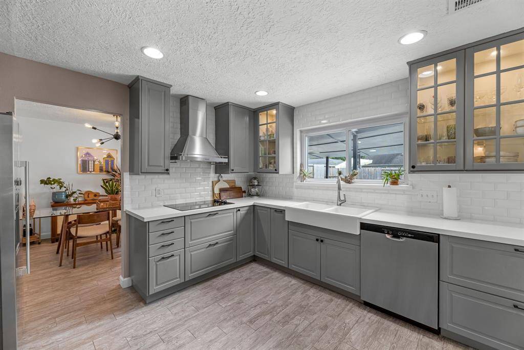 Kitchen features soft-closing cabinets, drawer & a stunning backsplash.