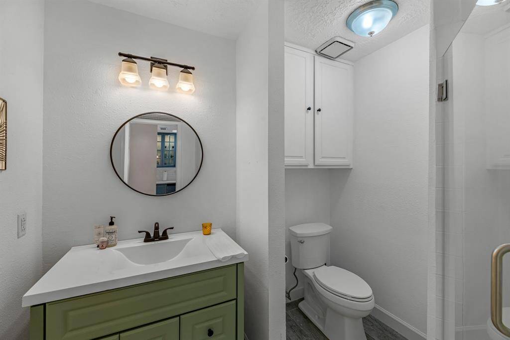 There's a full size bath down stairs completely with a frameless shower door.