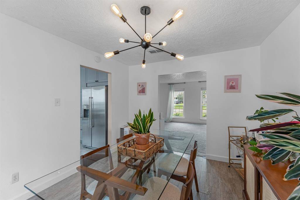 The open floor plan flows from the kitchen into the dining area.