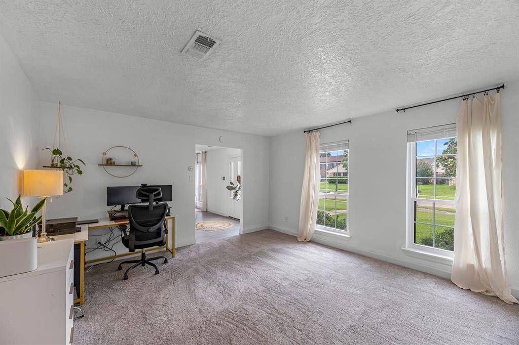Off of the dining area and to the left of the entryway is a  Office/2nd living area/ area/game room etc.