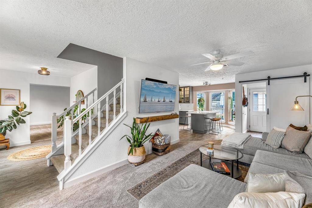 Living area is nice size and flows into the breakfast area & kitchen.