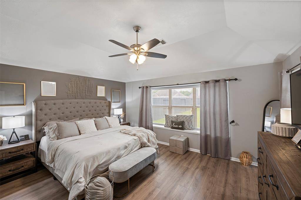 Primary ensuite with window seat. New vinyl plank flooring throughout the home August 2023.