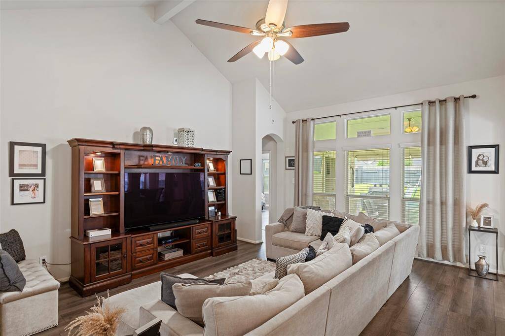 Floor to ceiling windows with great views of the oversized patio and spacious backyard.