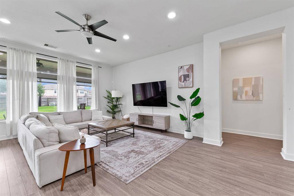 As seen here, the living room easily holds a sectional couch with room for plenty more!