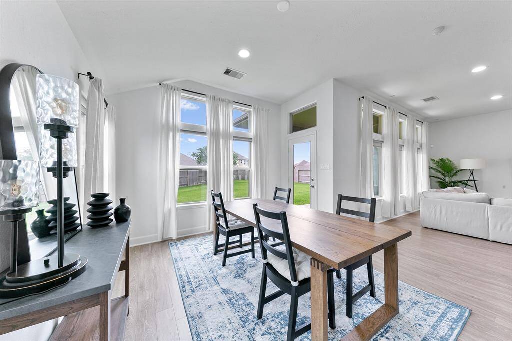 There is plenty of room for a sizable table and chairs here.