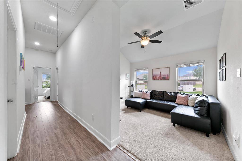 Back toward the front of the home is where you'll find this large space overlooking the front yard. Whether you utilize it as a formal living room, a game room, or even a study, there are so many possibilities to fit your needs.