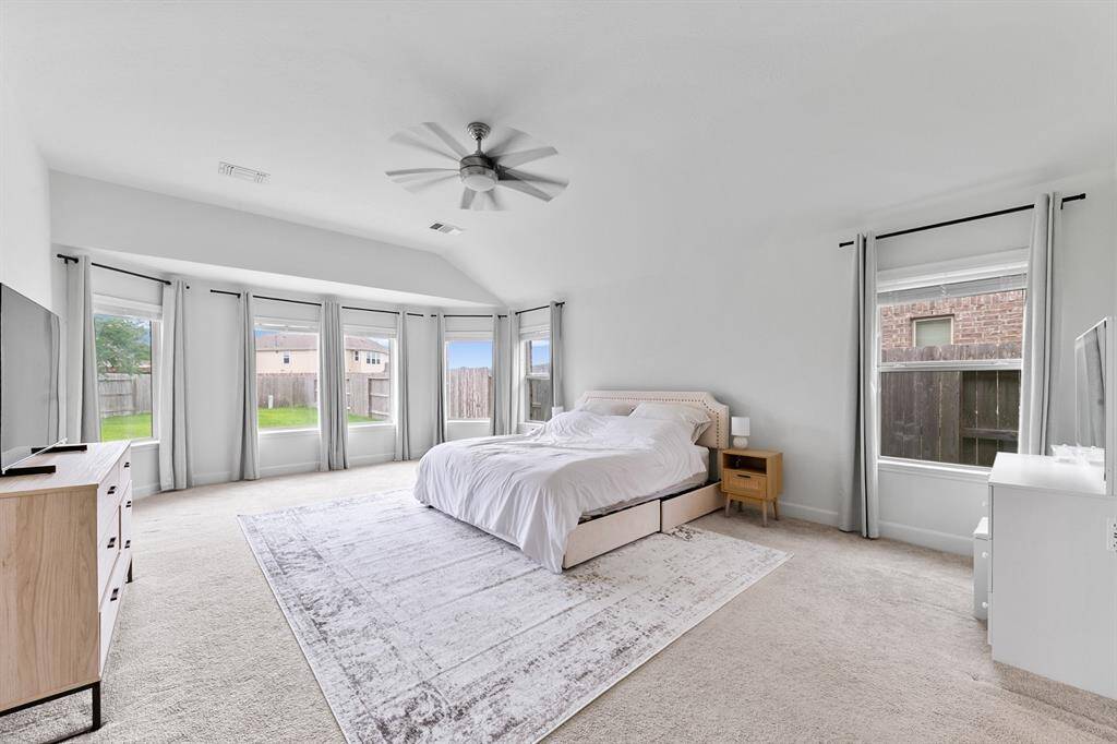 An impressive primary suite offers the perfect escape from the rest of the home. Add some comfortable reading chairs in front of the bay window and relaxation is just a few steps away.