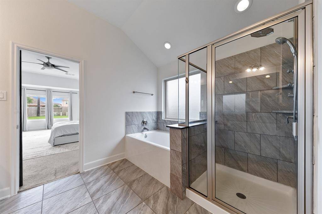 A large privacy window over the tub allows for natural light.