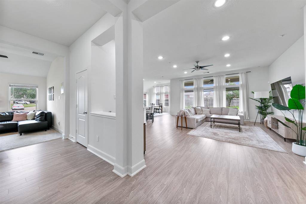 Wide entryways and high ceilings with recessed lighting create an open feel that welcomes family members and guests.