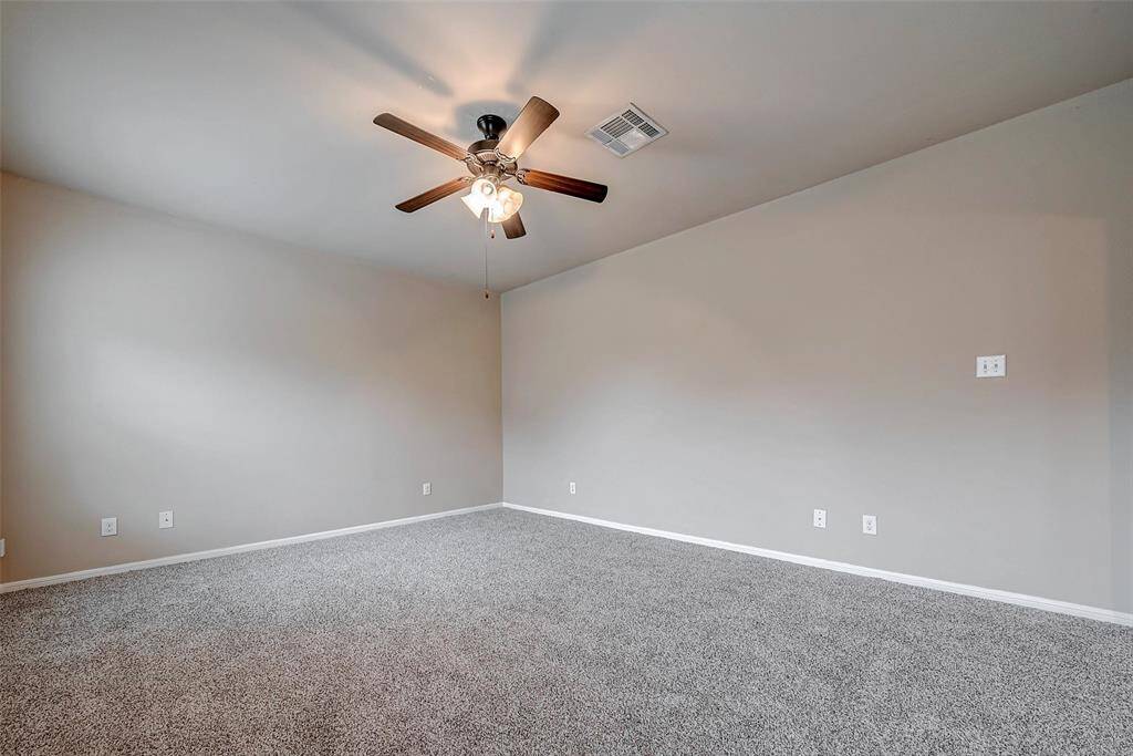 Living room with ceiling fan.
