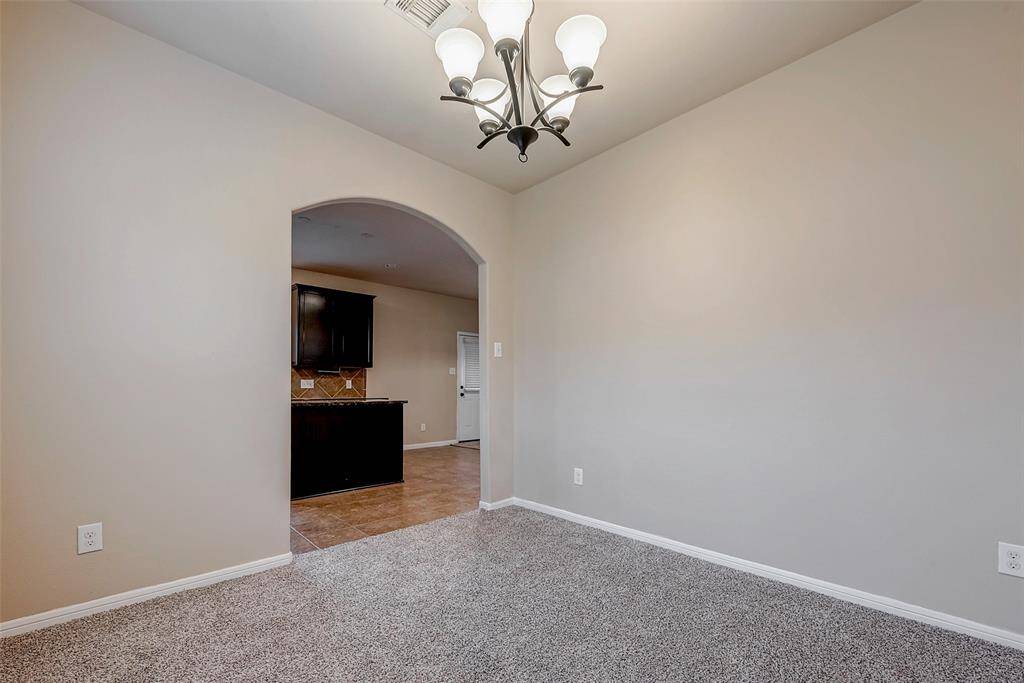Formal Dining room with chandelier