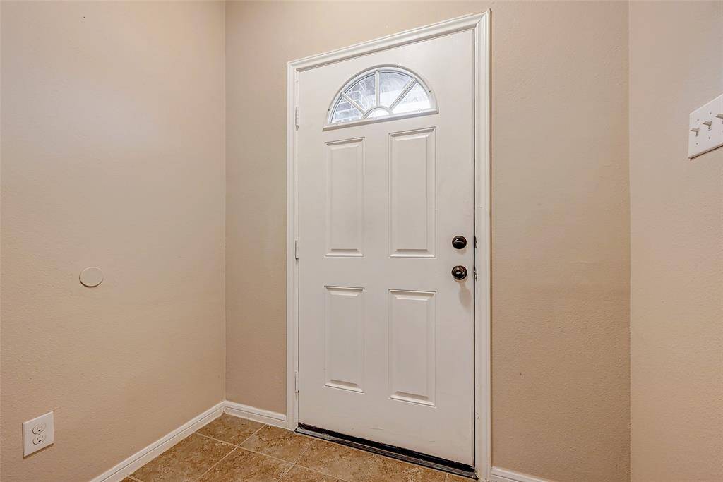 Foyer entrance with high ceiling