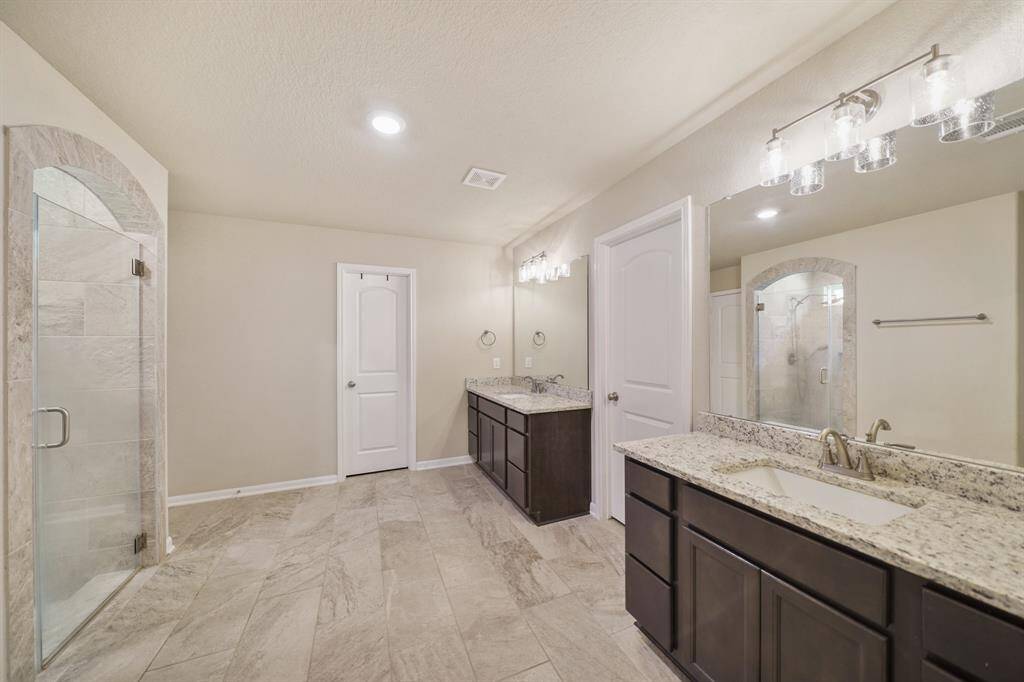 This master en-suite has generous space, and 2 walk-in closets.