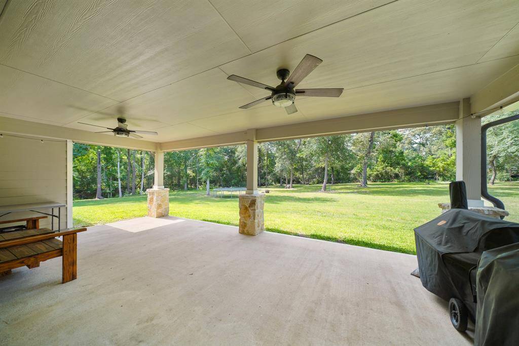 Get out from under the Texas sun, but still enjoy the great outdoors under this amazing covered patio!