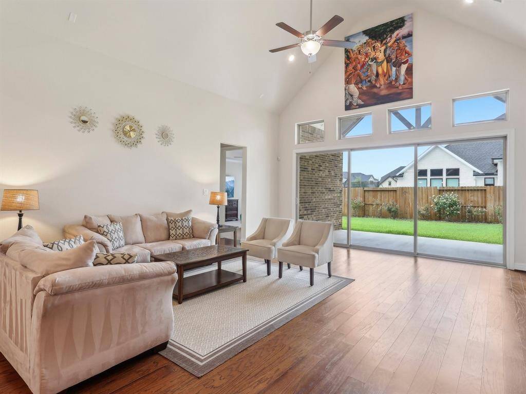 Expansive Sliding Glass Doors to Covered Patio