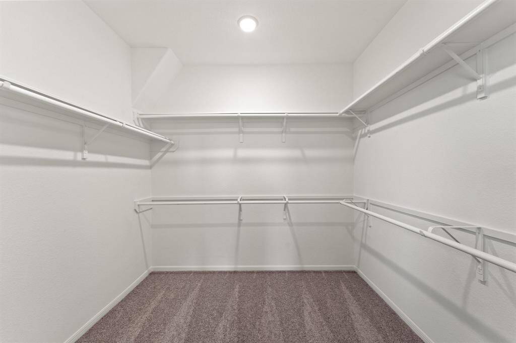 A view of your large primary walk-in Closet
