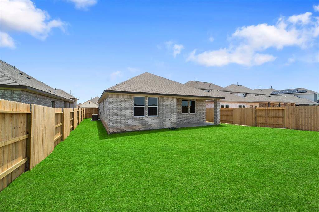 This backyard is perfect for family gatherings, social events, or simply unwinding in the fresh air.