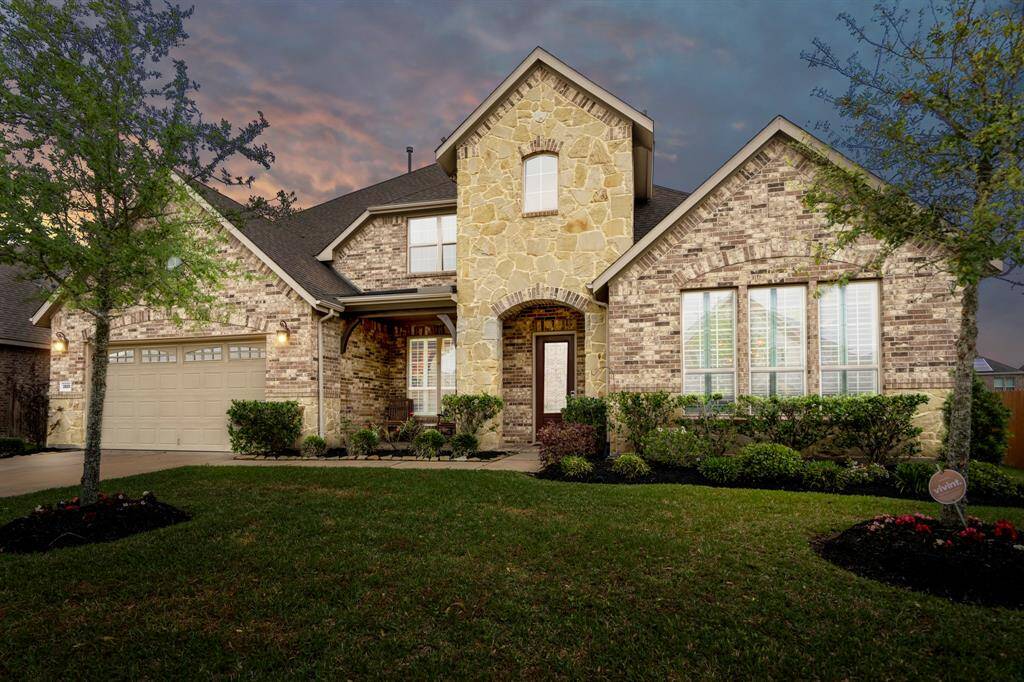 Welcome home! This beautifully crafted home boasts a striking brick and stone exterior, lush landscapting, and sensational curb appeal, creating the perfect first impression.