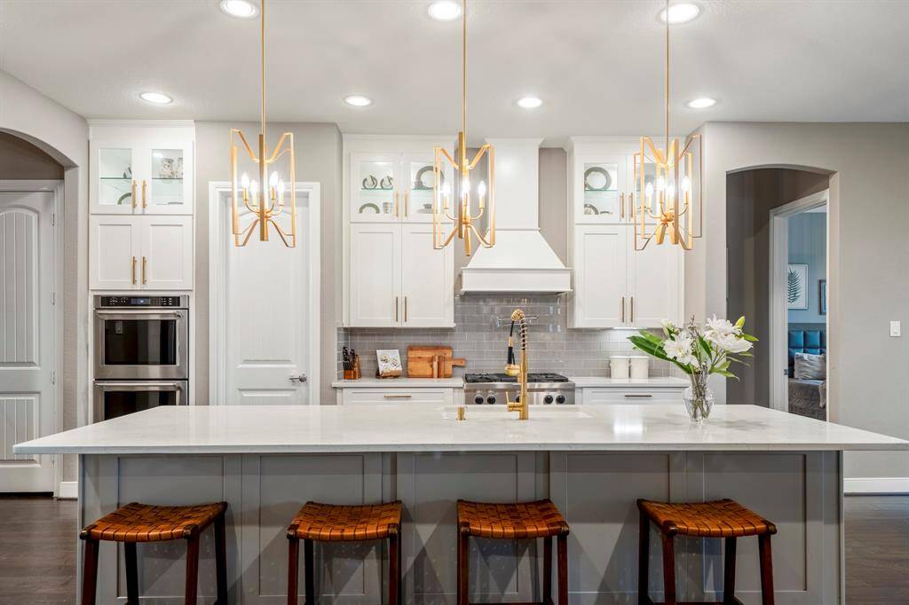 The extra-large kitchen island is perfect for conversation or that much needed space to lay out your party spread for everyone to enjoy!