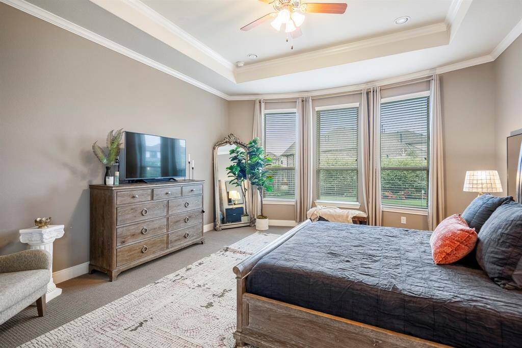 The primary bedroom welcomes you with bright natural light, an upgraded bay window with a relaxing sitting area, and the perfect view of the serene yard. It sits at the back of the home offering additional privacy and easily fits a king size bed plus furniture!