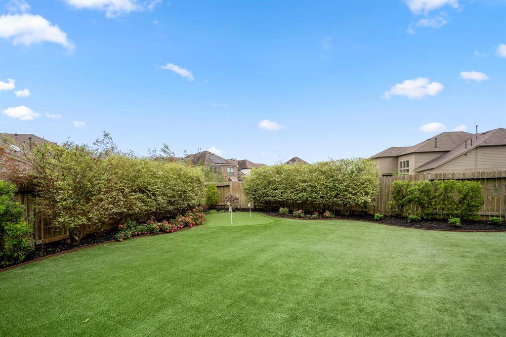 Perfect your short game just steps from your door with this professionally designed backyard putting green. Whether you're practicing for the course or enjoying a little friendly competition, this low-maintenance feature adds both fun and function to your outdoor space.