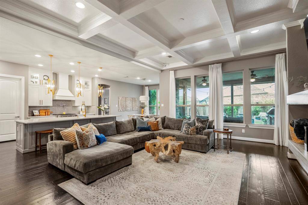 Step into this beautifully designed open-concept home, where modern elegance meets everyday comfort. The airy living space is bathed in natural light, seamlessly connecting to a covered patio and private backyard—perfect for relaxing or entertaining. The sleek kitchen boasts white cabinetry, chic pendant lighting, and a spacious island, making it the heart of the home. Don’t miss this stunning retreat!