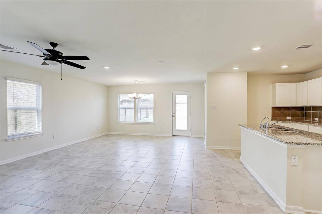 Tile floors all through the entry to the kitchen and family room.