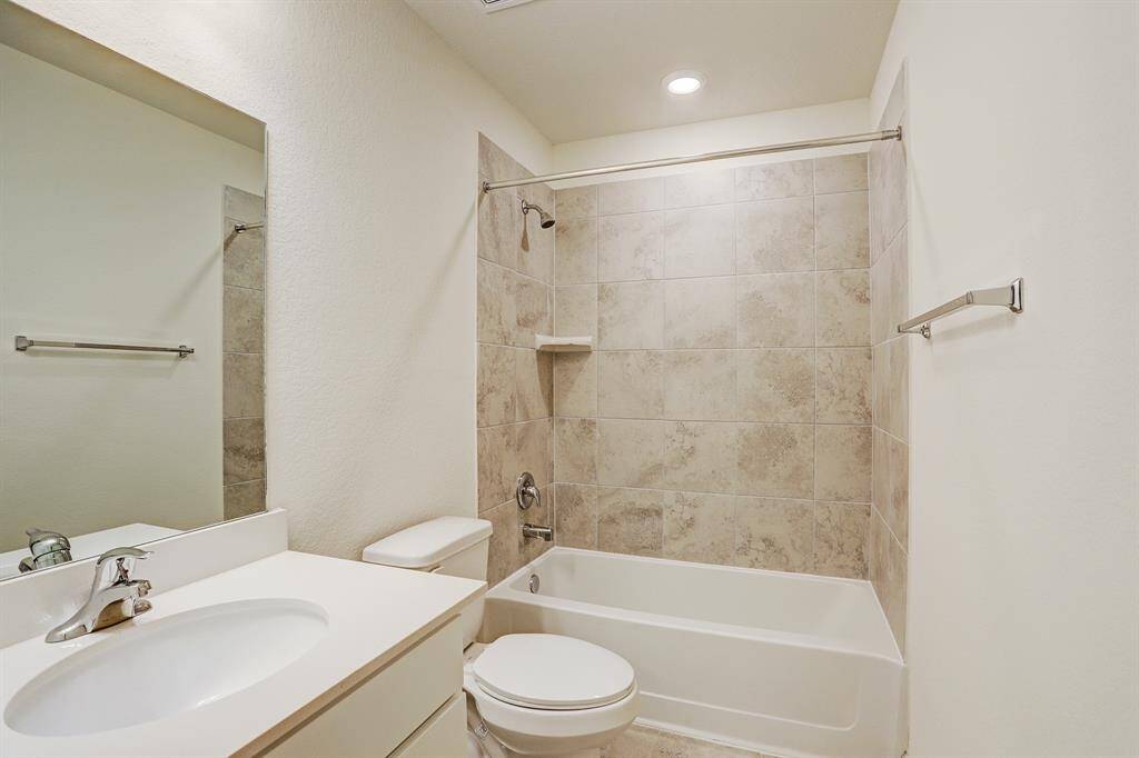 Tiled secondary bathroom.