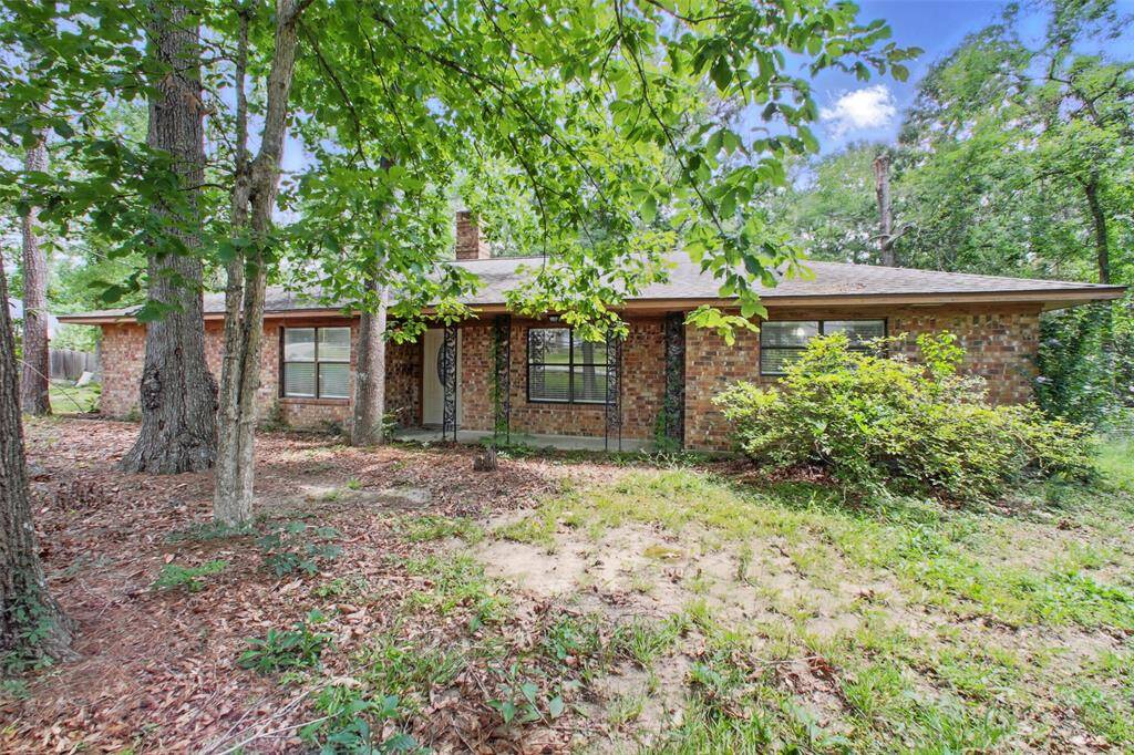 Welcome home to this timeless red brick residence, perfectly nestled on a lush, wooded .71-acre lot that offers privacy, character, and abundant space.