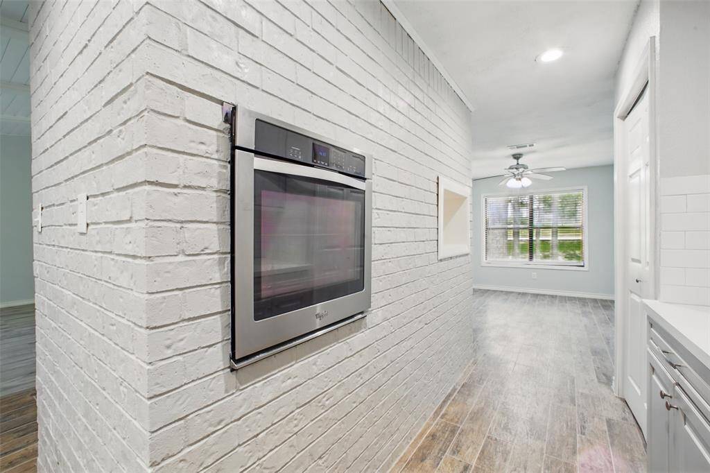 The kitchen’s transitional style blends clean lines with warm finishes—ideal for those who value both form and function.