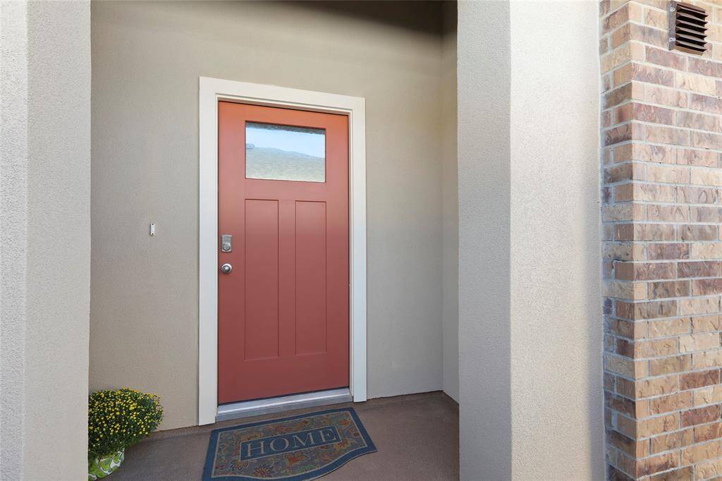 Enhanced front entrance with divine stained concrete floors