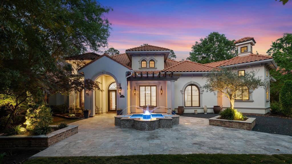 Living like a true one-story, this is a rare find, recently updated and meticulously cared for located behind the private 24 hour manned gates of Carlton Woods!