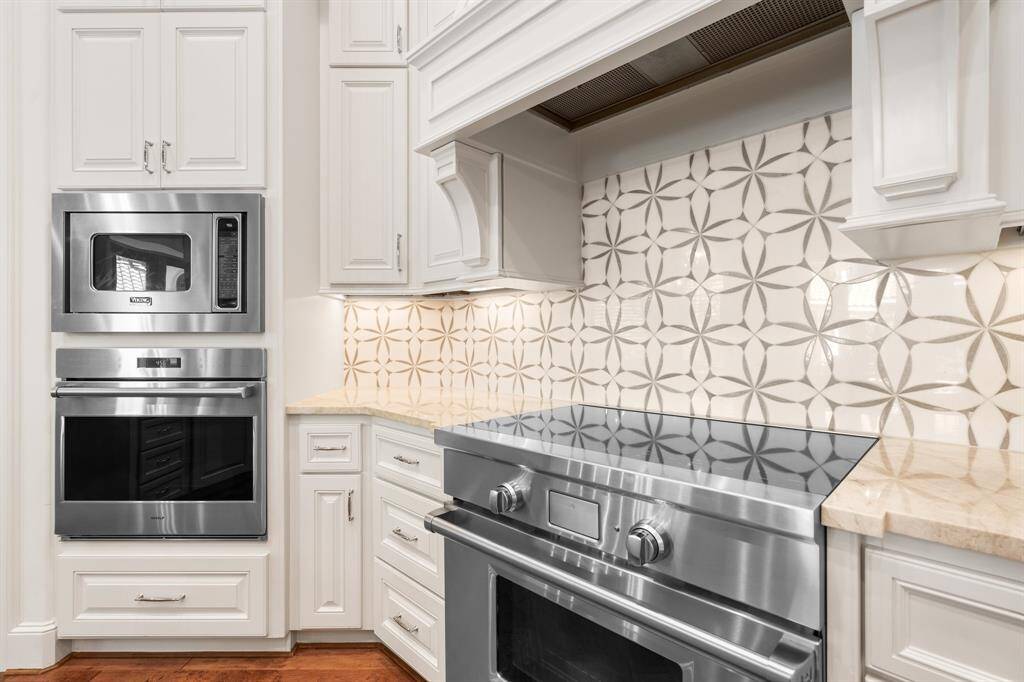 Stainless steel appliances include full size refrigerator, double ovens, microwave/convection and a new Viking Electric Range and new Bosch dishwasher.