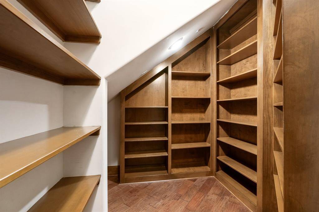 An oversized kitchen pantry provides abundant storage and organization, perfectly complementing the home's spacious and functional kitchen.