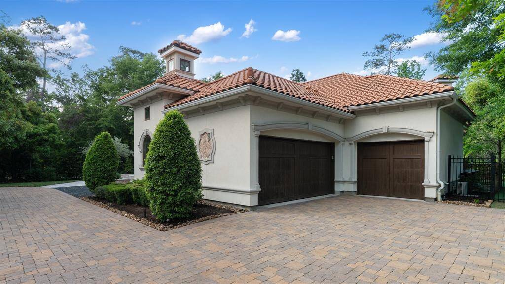 Generous parking and spacious garage w/ 3 bays and Tesla charging port.