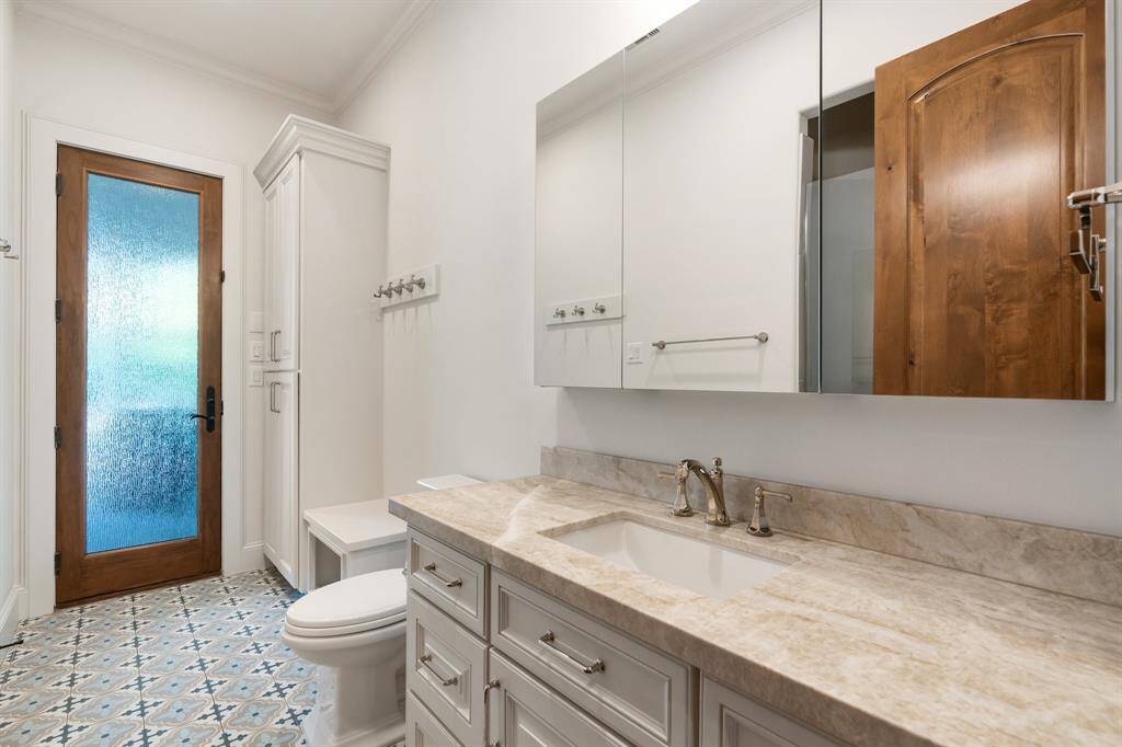 Secondary Bath #3 : offers designer floor tile and completely remodeled with all the bells and whistles. This bath has private access to the outdoor entertaining areas.