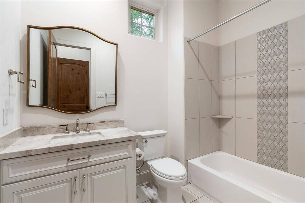 Light, bright and completely refreshed, bath number 4, features tub/shower combination.